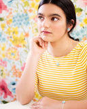 dainty turquoise jewelry on model