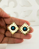 Square vintage style brass clip on earrings with blue stone