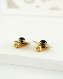 Square vintage style brass clip on earrings with blue stone