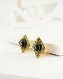 Square vintage style brass clip on earrings with blue stone