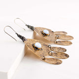 Mixed metal hammered earrings with light blue stone