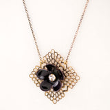 Black enamel flower necklace with vintage brass filigree