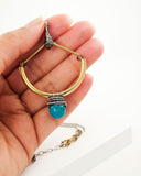 Turquoise mixed metal necklace with brass and silver