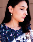 Gold tassel earrings with hand painted blue flower