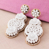 White hand beaded earrings