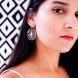 Large circle dangle earrings with light pink blue patina