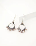 Silver circle earrings with blush raw zircon stones