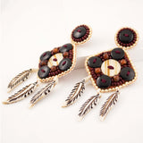 Tribal inspired bone and horn bead statement earrings