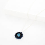 Navy blue circle pendant necklace with silver chain and rhinestone