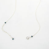 Navy blue circle pendant necklace with silver chain and rhinestone