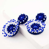 White & blue hand beaded statement earrings