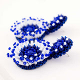 White & blue hand beaded statement earrings