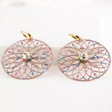 Large circle dangle earrings with light pink blue patina