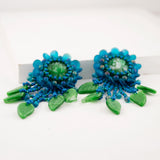 Teal green beaded statement earrings with vintage cabochon