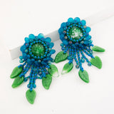 Teal green beaded statement earrings with vintage cabochon