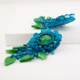 Teal green beaded statement earrings with vintage cabochon