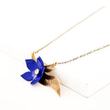 Royal blue enamel flower & antique brass leaves necklace