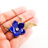 Royal blue enamel flower & antique brass leaves necklace