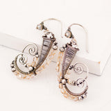Silver dangle earrings with champagne crystals