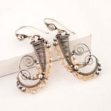 Silver dangle earrings with champagne crystals