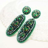 Emerald green statement dangle earrings