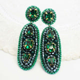 Emerald green statement dangle earrings